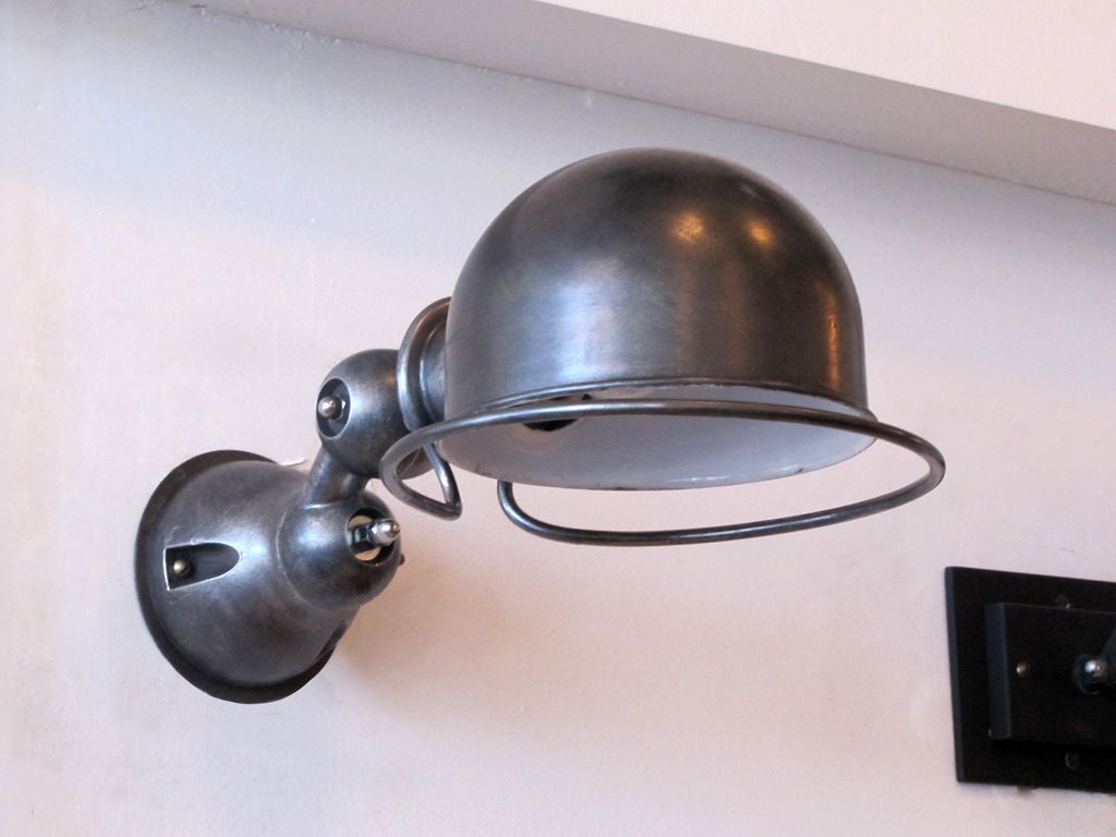 industrial wall lights by Jean-Louis Domecq for Jielde<br />
each sconce rotates & swivels separately on 2 axis for full coverage. <br />
black plate edition.<br />
PRICED AS PAIR @ $2600.00<br />
INDIVIDUALLY: $1400.00