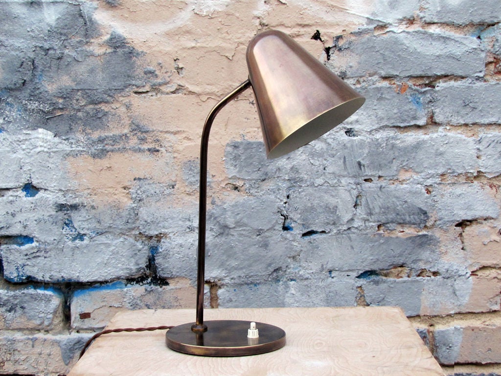 Two wonderful brass desk lamps by Jacques Biny, with on/off switch at the base.