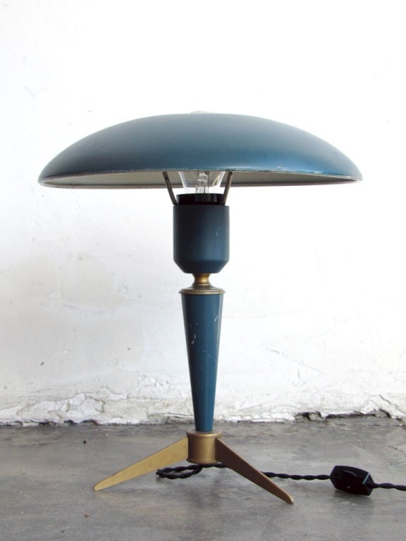 blue-ish/teal enameled metal table lamp with brass color accents <br />
by Louis Christian Kalff for Philips