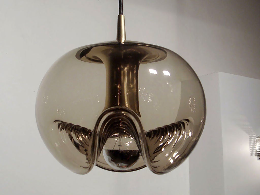 molded, smoked glass hanging fixtures<br />
with brass colored metal parts and custom brass canopy<br />
priced as a set, $1100 individually