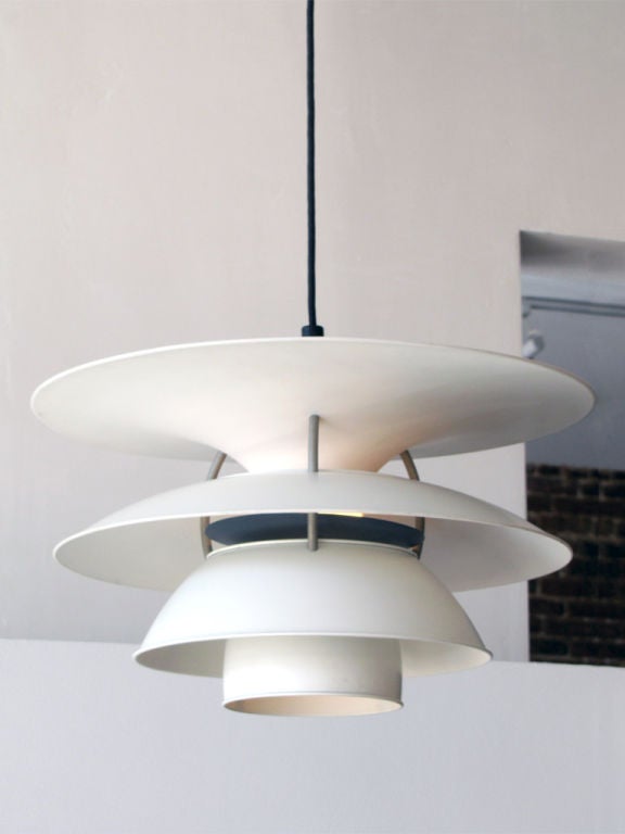 wonderfullarge pendant by Poul Henningsen for the Charlottenborg Exhibition Hall in Copenhagen , produced by Louis Poulsen, the enameled metal body is predominately white with grey hardware and dark blue reflector disc