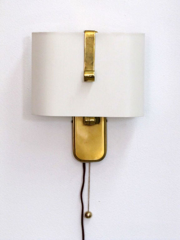 wonderful pair of dual position wall sconces by Hillebrand<br />
the articulate brass arm allows for 180 degree movement.<br />
the max protrusion with the arm in a horizontal position is 13