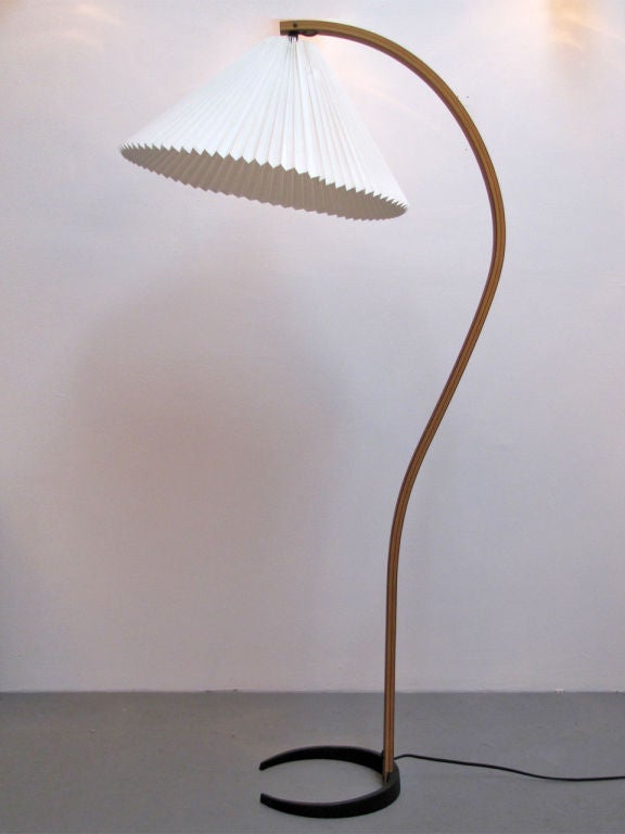 bentwood floor lamp by Caprani with original pleated fabic shade. the wiring is cleverly integrated in the teak bentwood post. cast iron crescent shaped base is stamped 