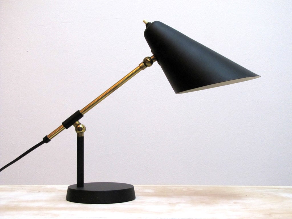 elegant danish table/bedside lamp
with fully adjustable arm and switch on top of the shade