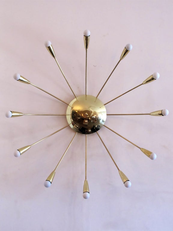 elegant twelve arm brass wall light by Gallery L7
can be used as flushmount ceiling light or with custom drop