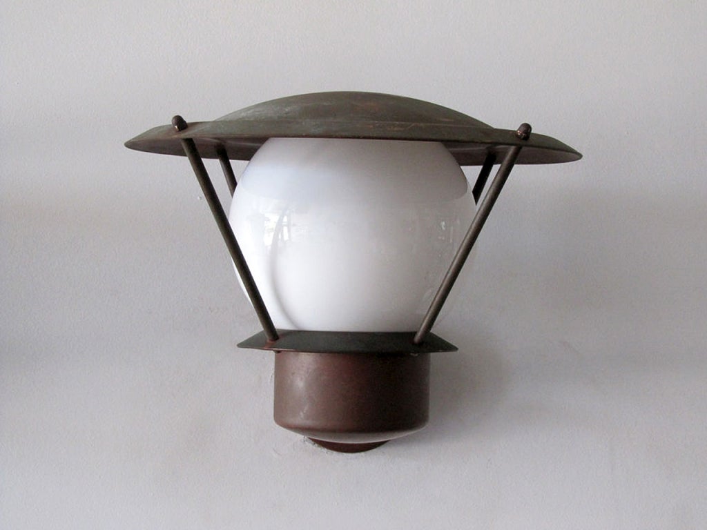 five danish copper wall lights with milk glass globes
suitable for indoor and outdoor use
priced individually