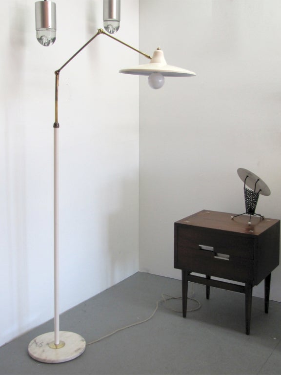 wonderful, articulate floorlamp by Stilux
two fully adjustable brass arms, marble base
on/off switch on the shade