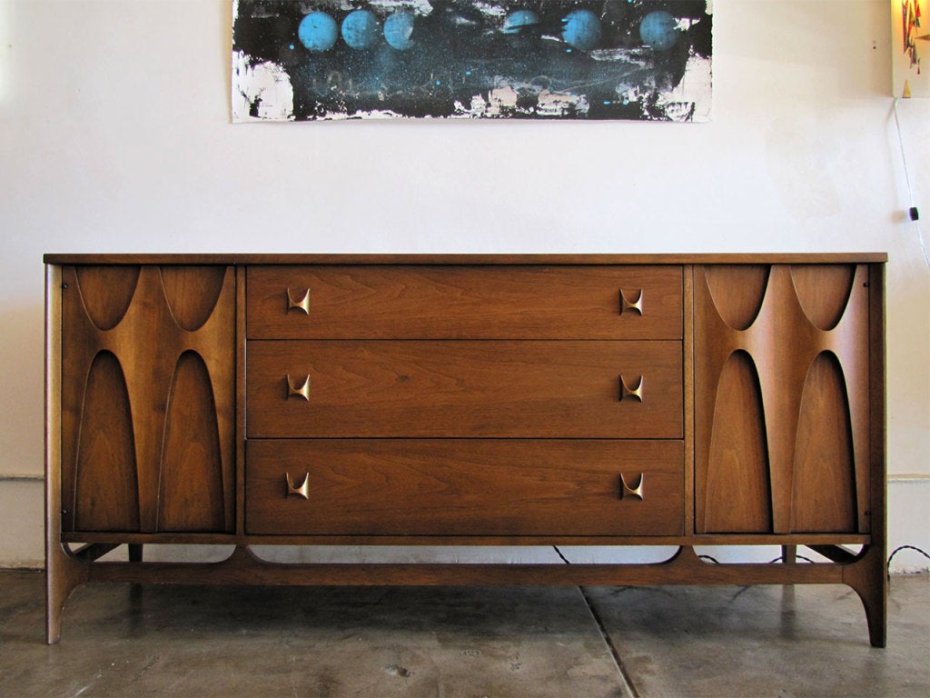 original Brasilia 3 drawer/2 door credenza by Broyhill Premier 
this line was an homage to Oscar Niemeyer's architecture of Brasil and was first featured at the Seattle World’s Fair in 1962 representing the city of Brasilia. Great sculpted wood