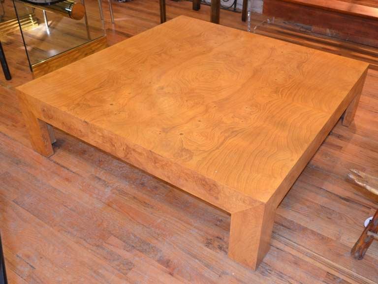 A generously proportioned Milo Baughman Parsons style coffee table.
This large coffee table is clad in bueatifully book matched burled olive.
We are always adding to our 1st dibs inventory so be sure to include 
us on your favorite dealer list
