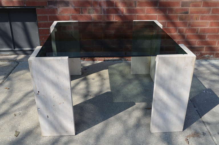 A 1970s vintage travertine and smoked glass coffee table.
The table could also be used as side table.
