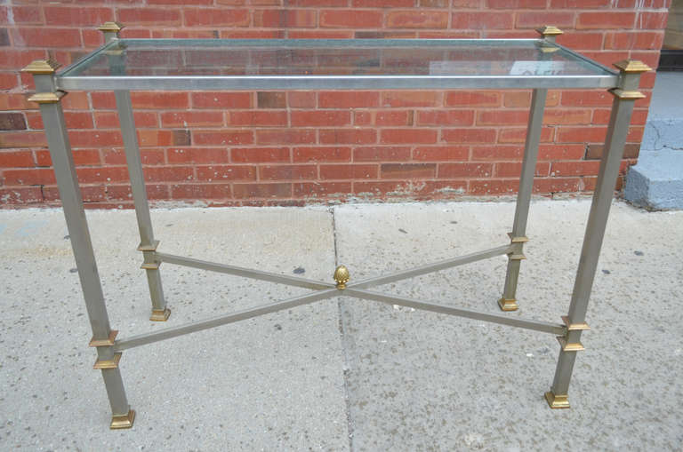 A steel and brass console by Maison Jansen. The table has a glass top.
We are always adding to our 1stdibs inventory so be sure to include
us on your favorite dealer list and visit our storefront regularly.