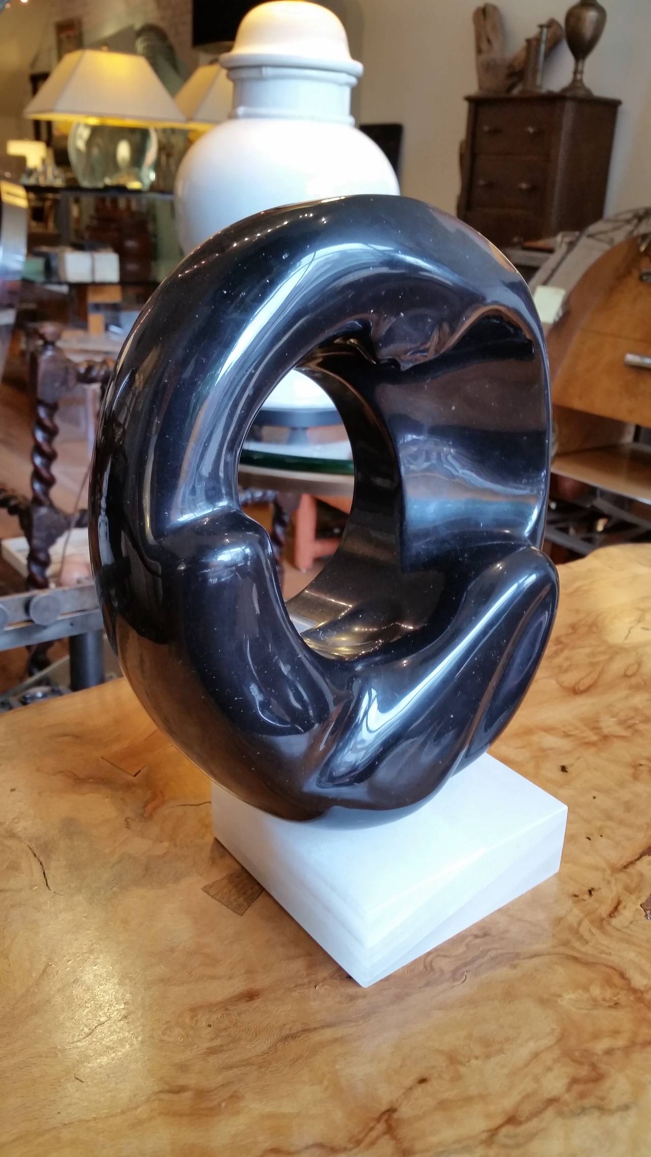 An organic Belgian black abstract marble sculpture on an onyx base.
Beautifully carved and great from all sides.
Intriguing play of positive and negative spaces. Not signed.