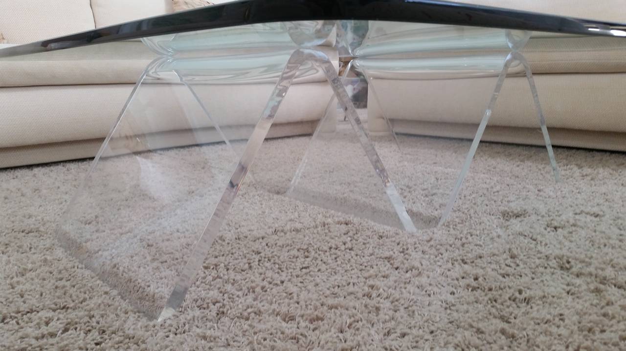  Lucite Mid-Century coffee table with a thick wave form base.
The original glass is 3/4 inch thick and measures 48x48.