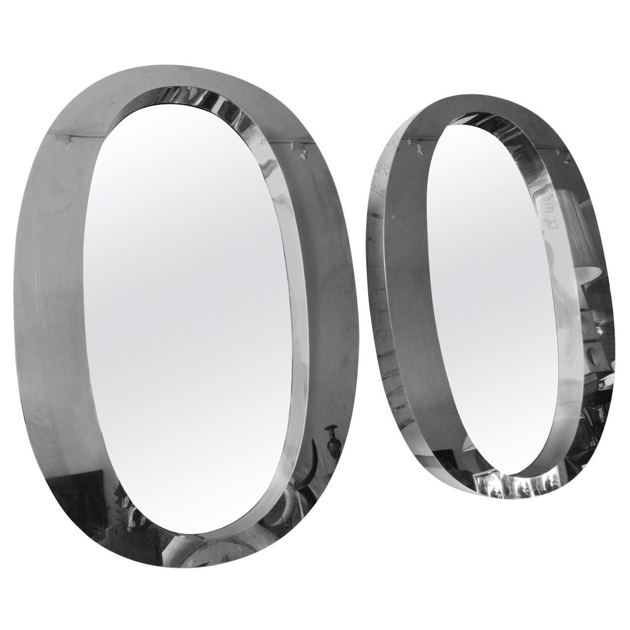 Pair of One of a Kind Modern Oval Stainless Steel Mirrors For Sale