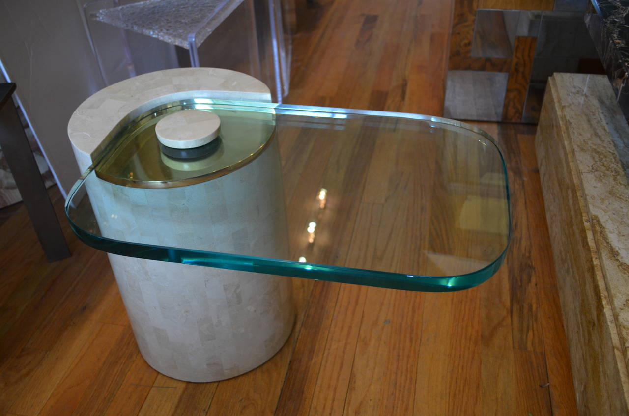  Karl Springer occasional side  table with a one inch thick plate glass
cantilevered top over a brass plate.