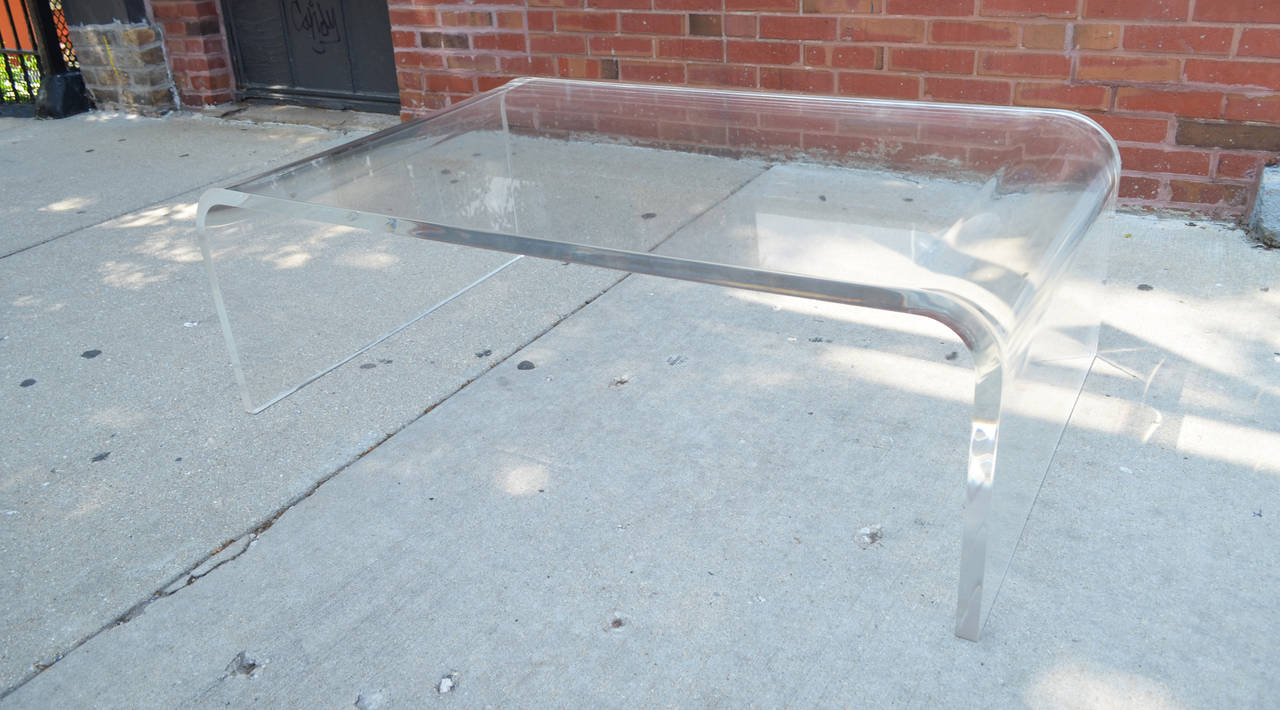 An exceptionally thick vintage acrylic coffee table.