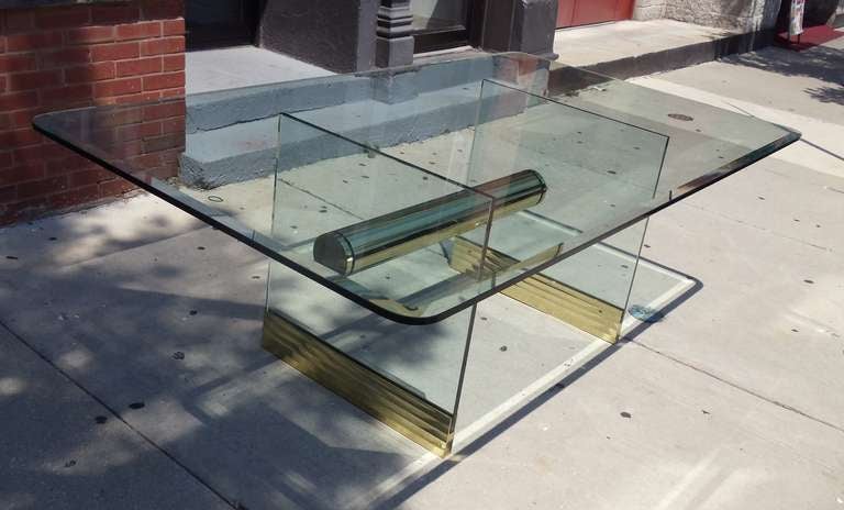 A large impressive seven foot glass and brass Pace dining table or desk. 



