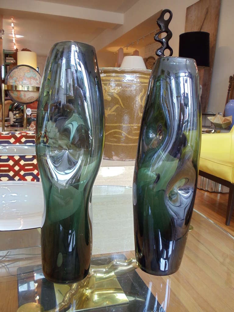 A pair of organic form Italian handblown glass vases. The pair almost identical strikes a most sensual composition.