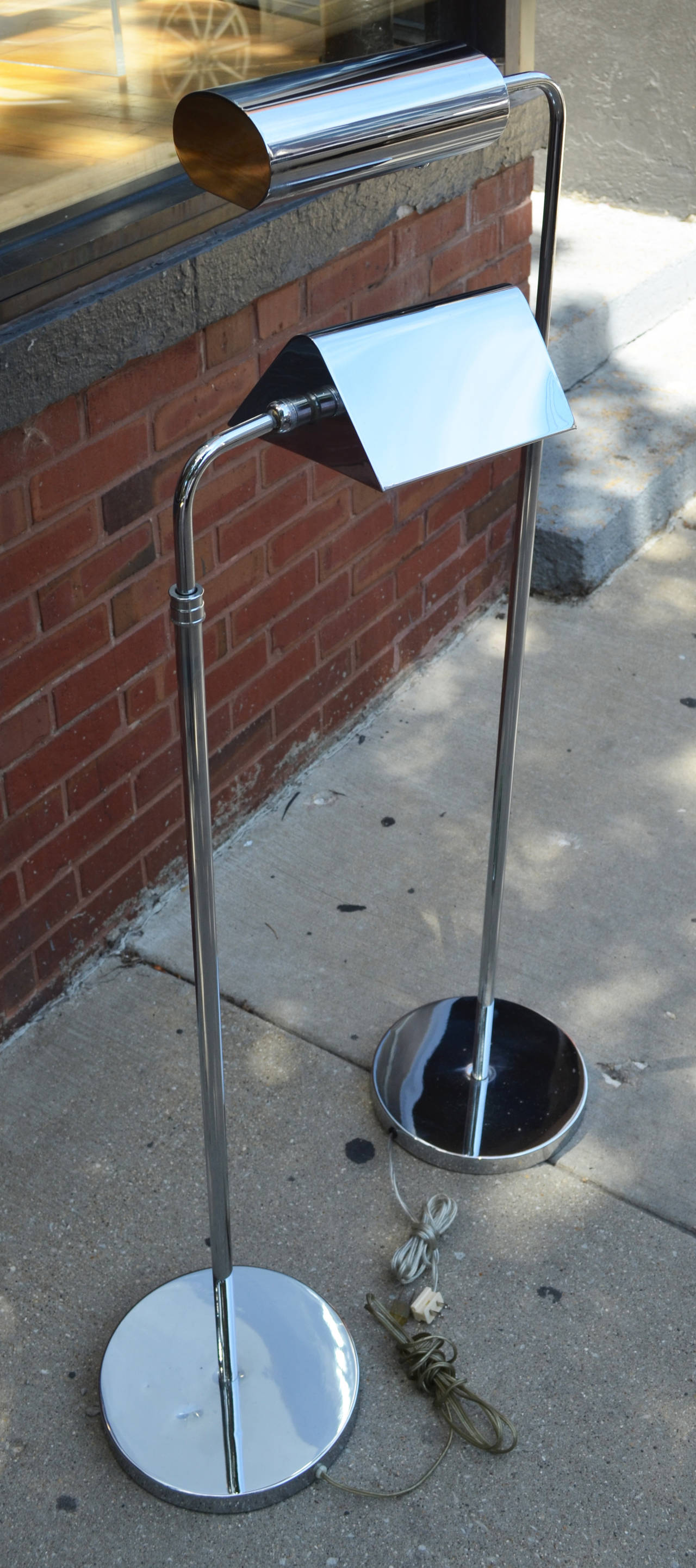 The chrome tent shade telescoping pharmacy floor lamp has been sold.
The  articulating floor lamp with an elongated tube shade is still available.
The Koch & Lowy floor lamp has a dimmer switch.
Sold individually $975 each.
