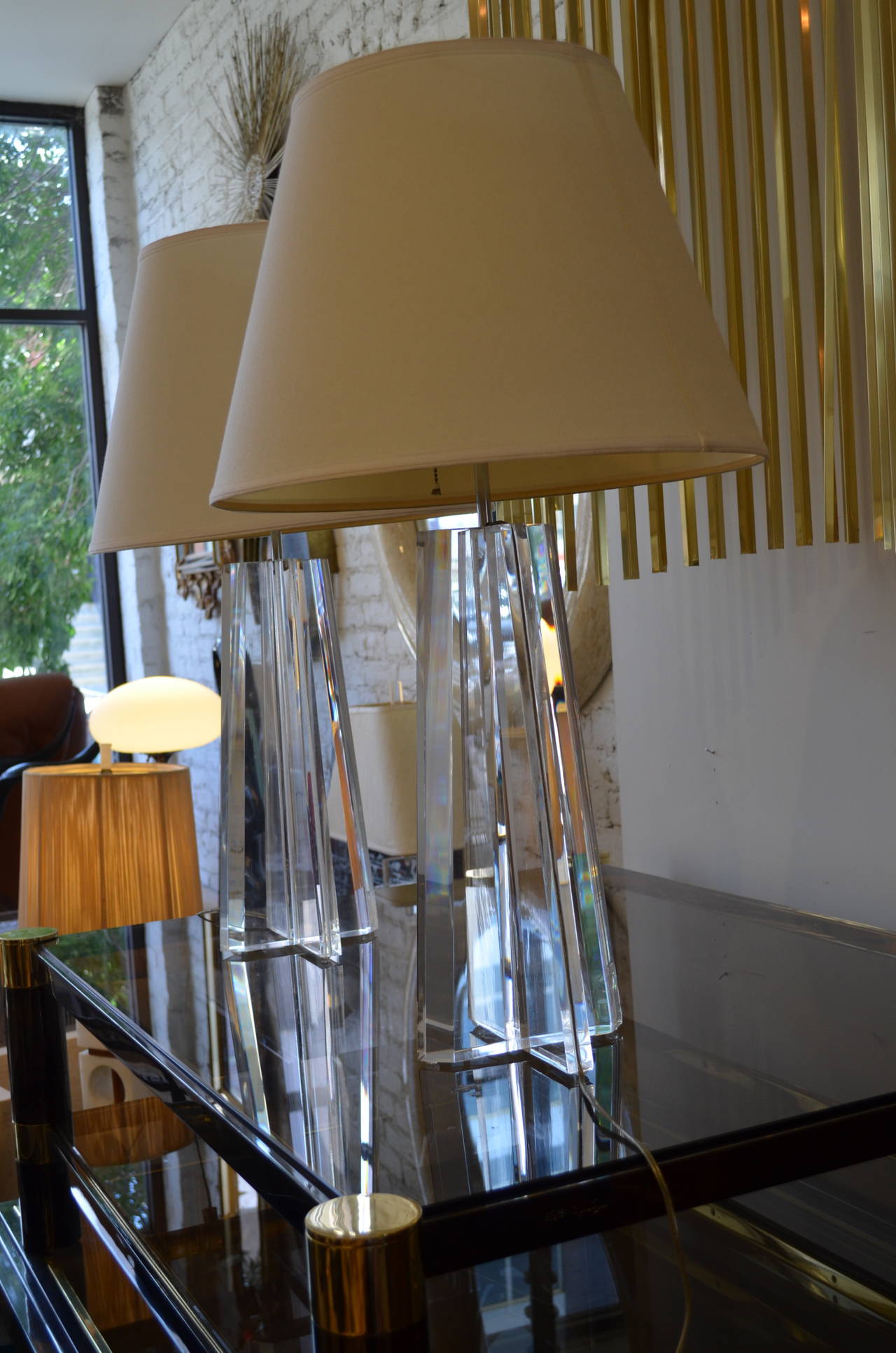Lucite pair of Les Prismatiques table lamps.
The cord is set into a channel on the side of the lamp.
Chrome-plated hardware. Finest quality.
Shades not included.