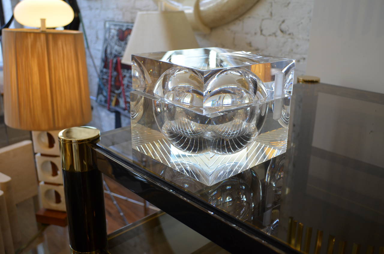 Fantastic vintage heavy acrylic Lucite box with a top that pivots open.
The rare box is in the manner of Alessandro Albrizzi.
A spherical orb floats in a block of thick Lucite.