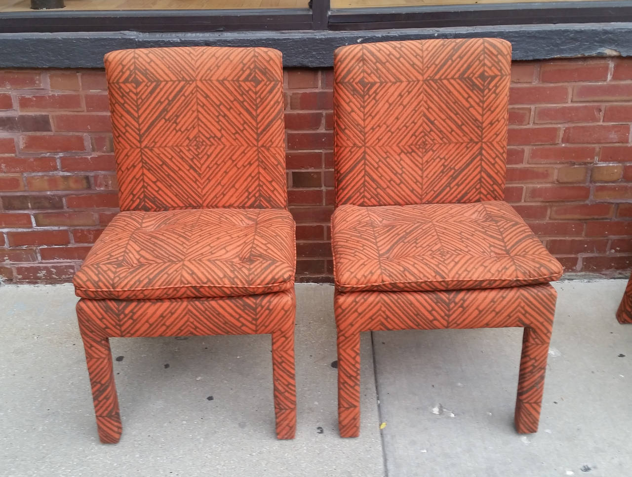 A set of six 1970's fully upholstered dining chairs by Milo Baughman
for Thayer Coggin. The set includes two-arm or captain’s chairs
and four side chairs. The fabric is in good vintage condition but could be
updated.