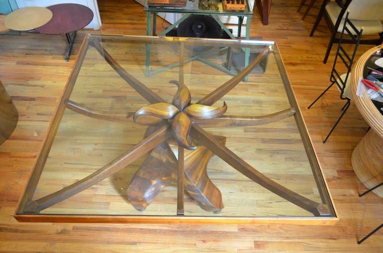 An exceptional pair of custom Studio Craft wood and glass dining tables. The joinery and craftsmanship are of the finest quality. This sculpted table is a functional work of art. The table is composed of two 52 x 52 square tables. The tables are on
