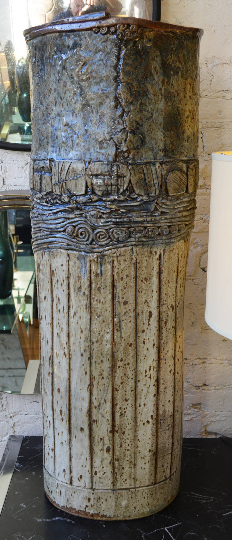 An impressive signed monumental ceramic vessel by the Wisconsin artist

Robert Caldart. He is well known for his bold large scale pieces.

This hand thrown vase measures over three feet tall. It is lage enough

for use as an umbrella stand.