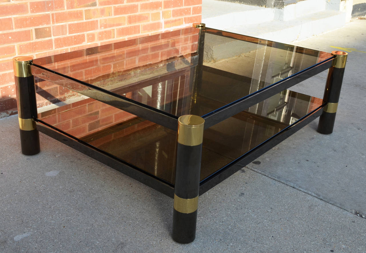 A large-scale two-tier Karl Springer round leg coffee table.
The glass is a rich smoked amber. This quality of the table,
Is exceptional. Original pristine condition.