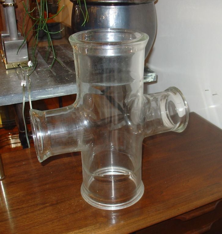A Pyrex conical laboratory pipe. The pipe is somewhat cloudy. This is a wonderful decorative item. Only one available, the pipe on the left has been sold.
