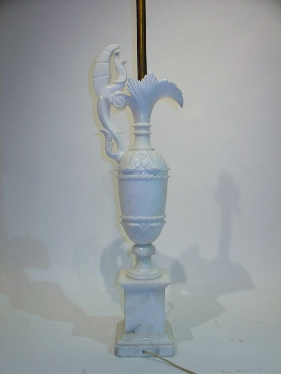 Alabaster ewer style Italian lamp. The lamp is 52 inches to the top of the finial.