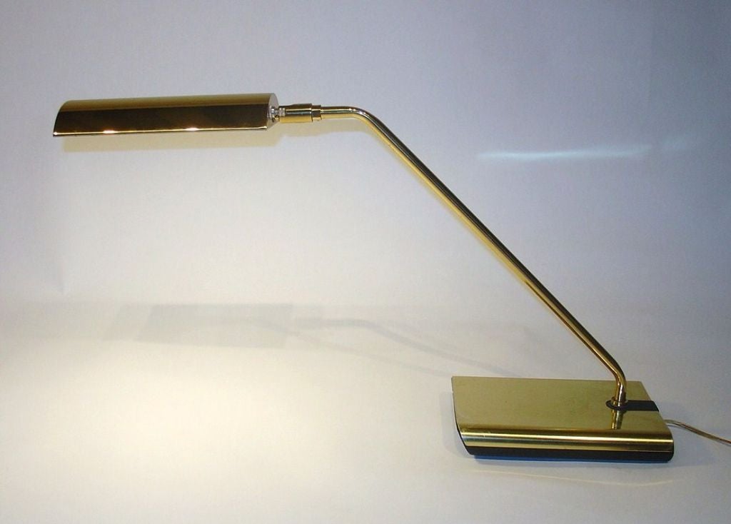 A Koch & Lowy brass articulating desk lamp.