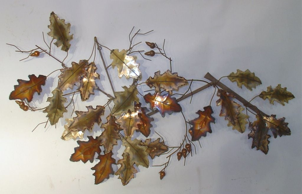A large brass oak leaves and acorn wall sculpture by Curtis Jere dated 1976.