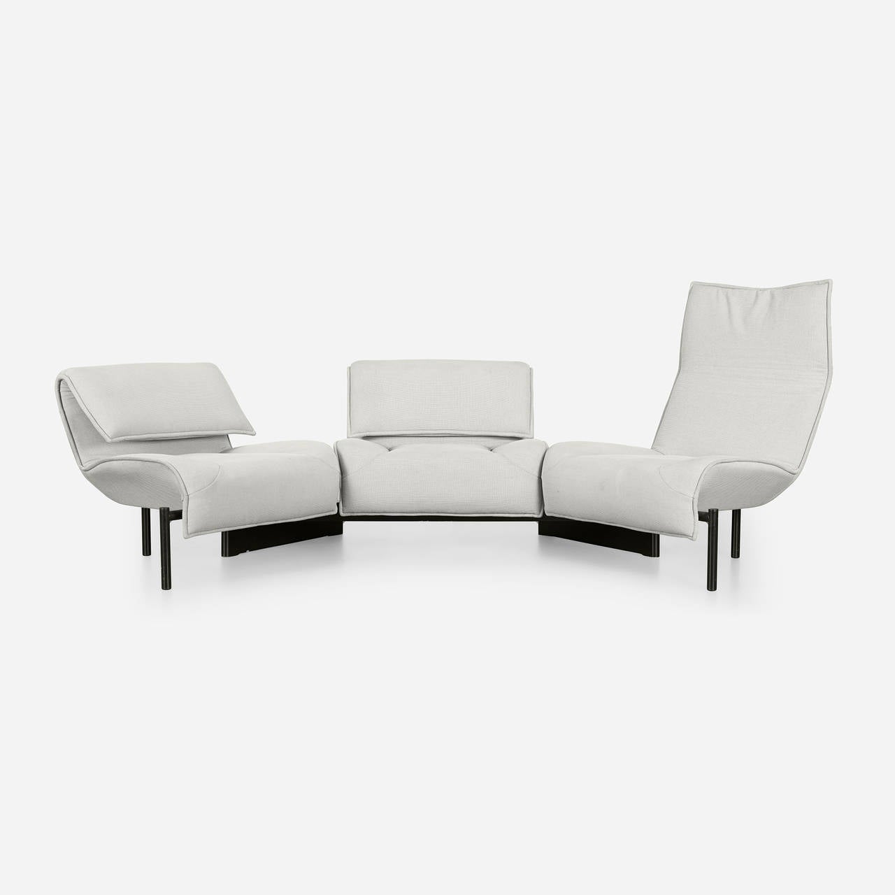 Sofa features three sections that can be rotated to create separate seats.