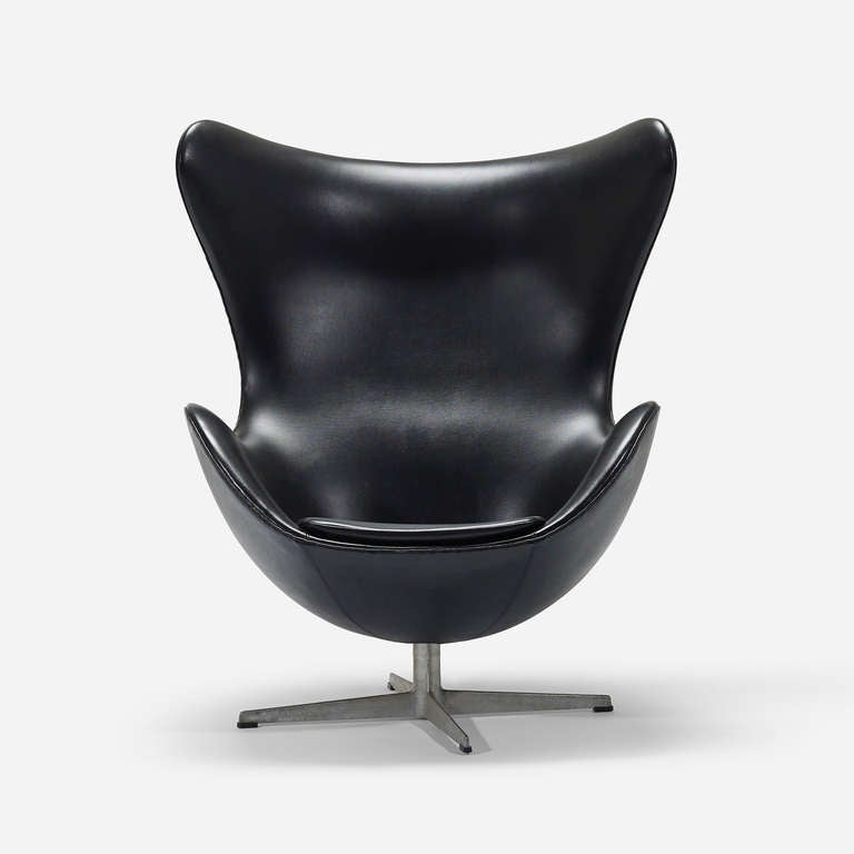 Signed with cast manufacturer's mark to underside: [FH Made in Denmark] with applied foil manufacturer's label to frame: [FH Made in Denmark 7106 by Fritz Hansen].