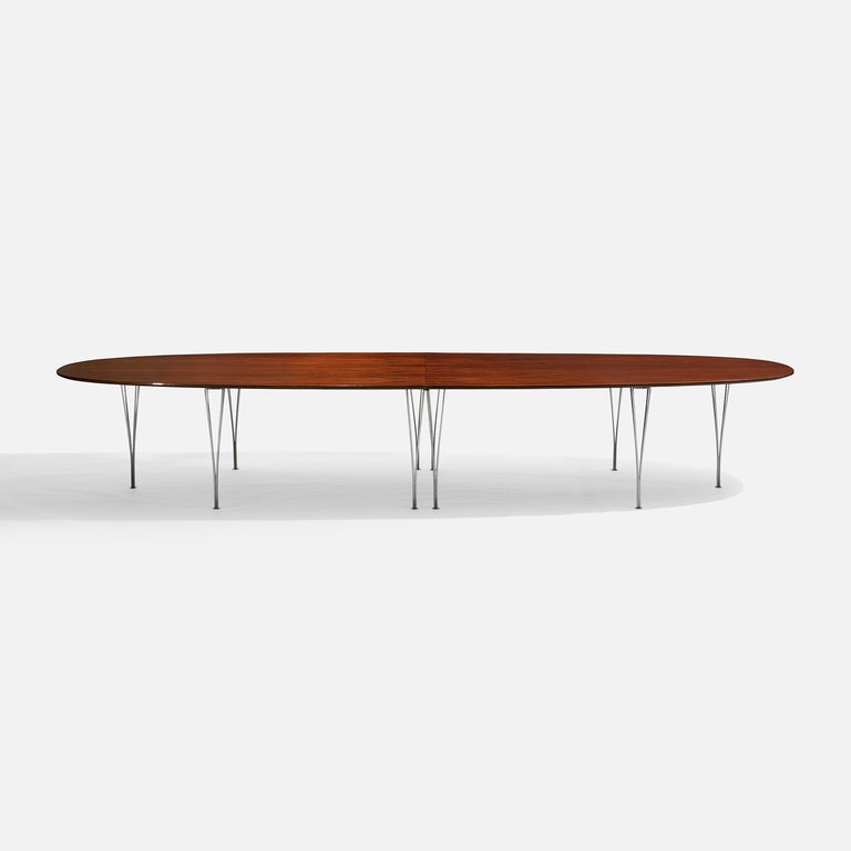 Signed with decal manufacturer's label to underside: [FH Made in Denmark 1975 by Fritz Hansen]. Measuring nearly fourteen feet in length, this generously sized table has all the hallmarks of exceptional Scandinavian craftsmanship. 