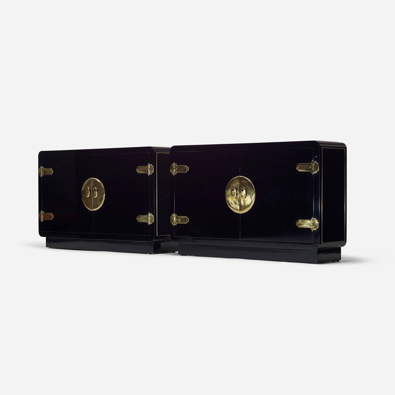 Each cabinet features two doors and one adjustable shelf. Signed with applied brass manufacturer's label to reverse of each: [Mastercraft of Grand Rapids].