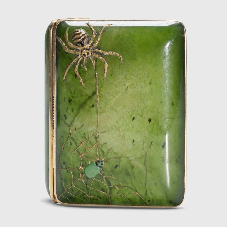 Signed with impressed manufacturer's mark to interior: [Tiffany Co. 14k]. An exquisite turn of the century gold and nephrite case by Tiffany & Co., ideal for cigarettes or business cards. The case is made of translucent emerald nephrite, giving this