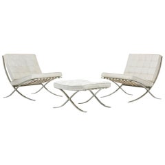 Barcelona chairs, pair and ottoman by Ludwig Mies van der Rohe