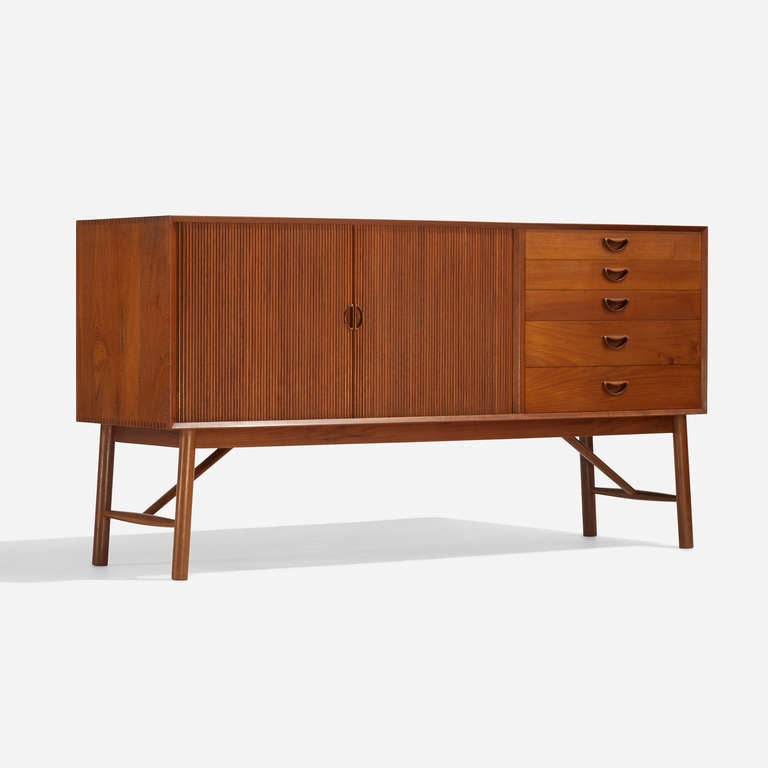 Cabinet features five drawers and two tambour doors concealing one adjustable shelf. Signed with partial decal manufacturer's label to reverse: [Soborg Møbler Made in Denmark].