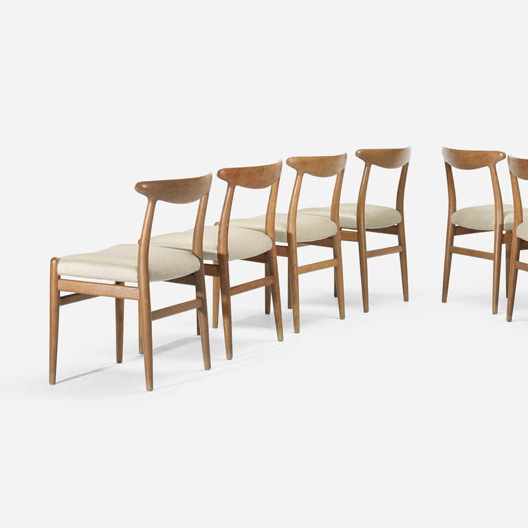 Signed with branded manufacturer's mark to each chair: [C.M. Madsens Fabriken Haarby Danmark Made in Denmark Design: Hans J. Wegner.].