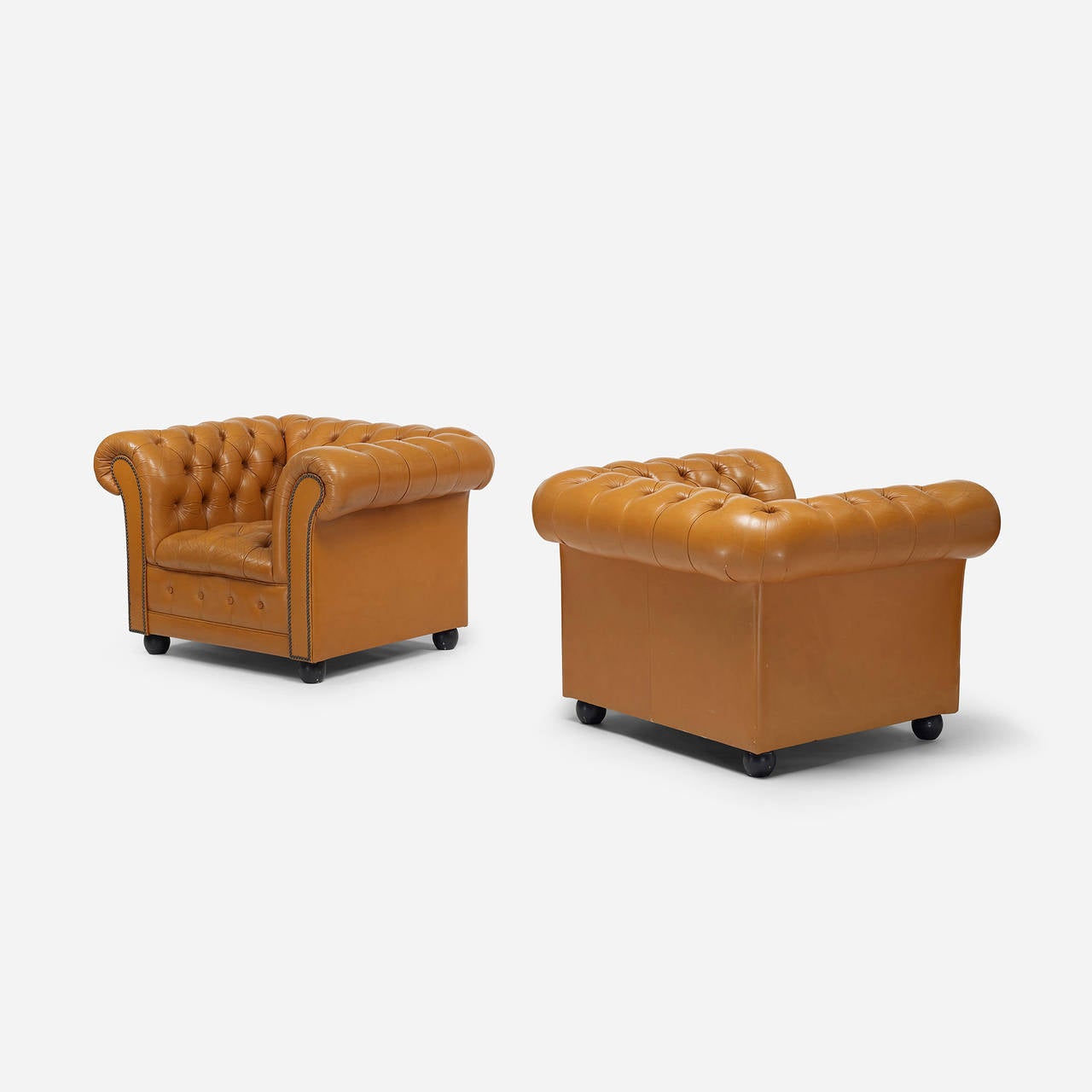 Pair of Chesterfield lounge chairs.