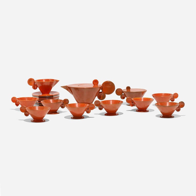 Service includes lidded teapot, lidded sugar bowl, creamer, eight tea cups and eight saucers; nineteen pieces total. Signed with glazed manufacturer's mark to underside of each example: [182 26].