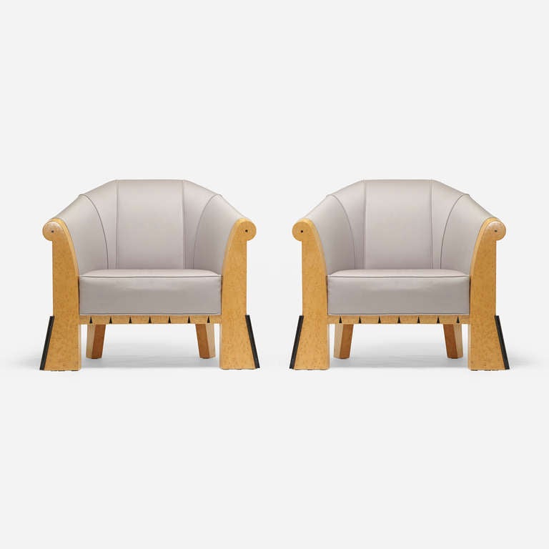 A pair of upholstered armchairs by American architect and designer, Michael Graves.