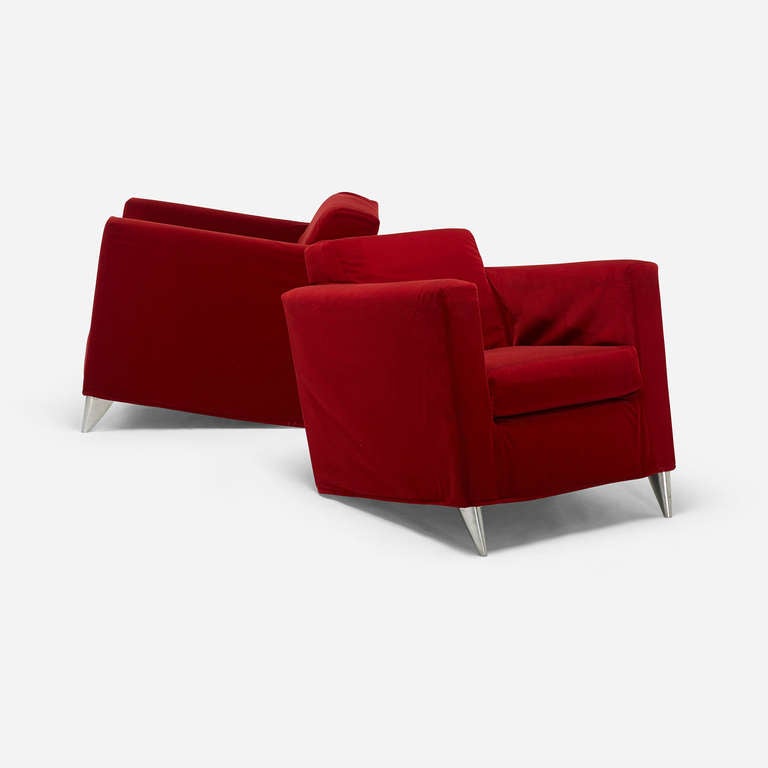 This pair of lounge chairs exemplifies contemporary designer Philippe Starck’s uninhibited approach to design. Appearing to tilt back without rear legs, the  design plays on the tension between slanting, seemingly off-balance lines and angles.