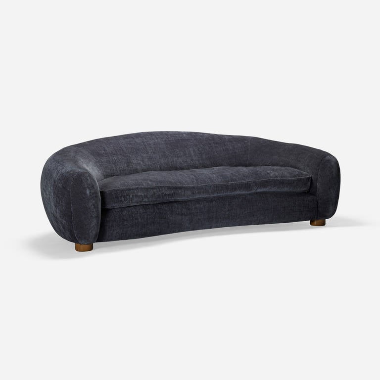 This is an expertly crafted, recent production of the 'Ours Polaire' sofa by Jean Royère created for a high end residential project. The upholstery is a supple, dark gray textured velvet.