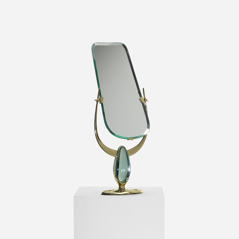 Max Ingrand served as the artistic director of the Fontana Arte from 1954 to 1964. This beautiful table mirror of crystal and brass is exemplary of Ingrand's elegant designs.