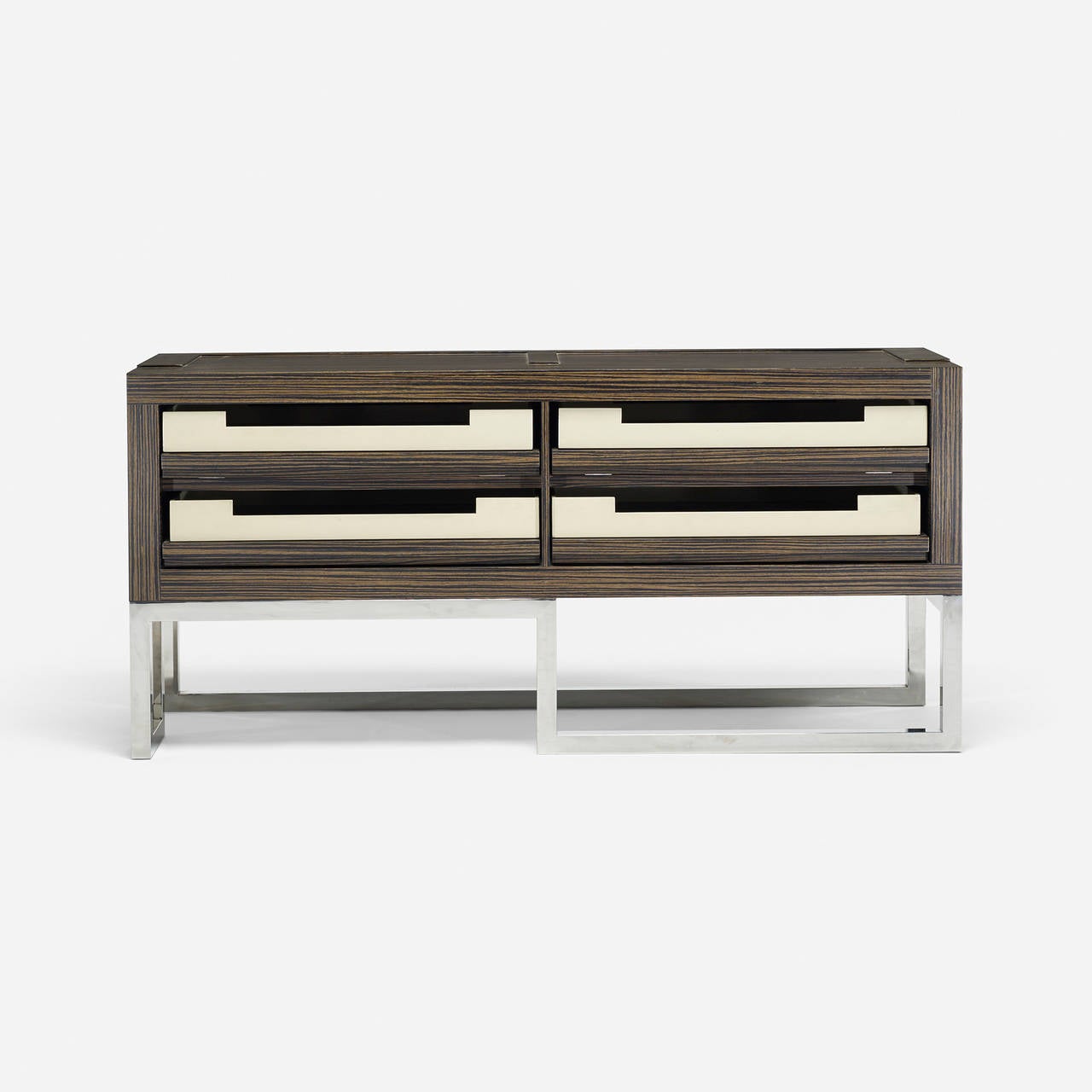 Cabinet features four drawers each containing a removable lacquered tray.