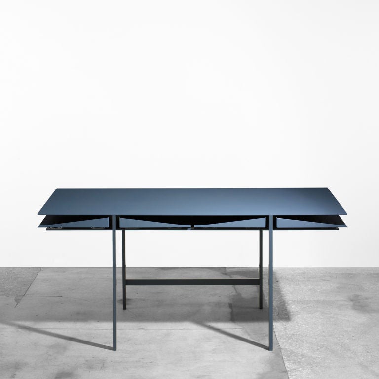 The Folia desk features four sliding divided trays and is available in assorted colors. Impressed number and date to underside of each example.