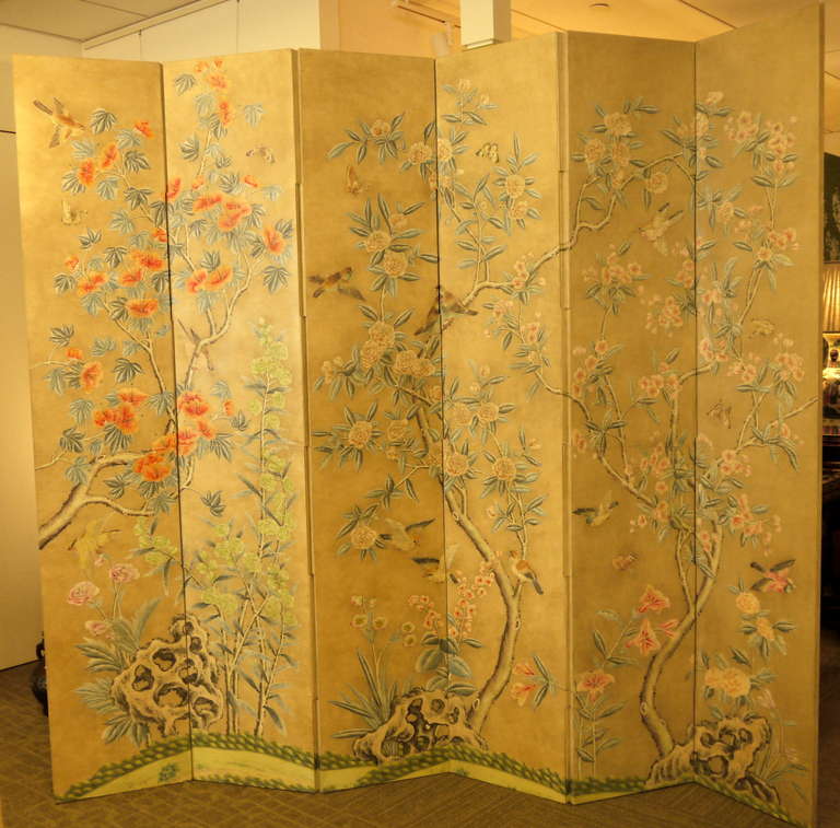 A six panel screen with beautifully painted Chinese floral and bird design dating to the 1960's, by Gracie.

Matching background paper is on the reverse of the screen.  Screen has French hinges, and the design is painted through each